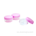 Tarro cosmético de plástico pequeño con tapa rosa